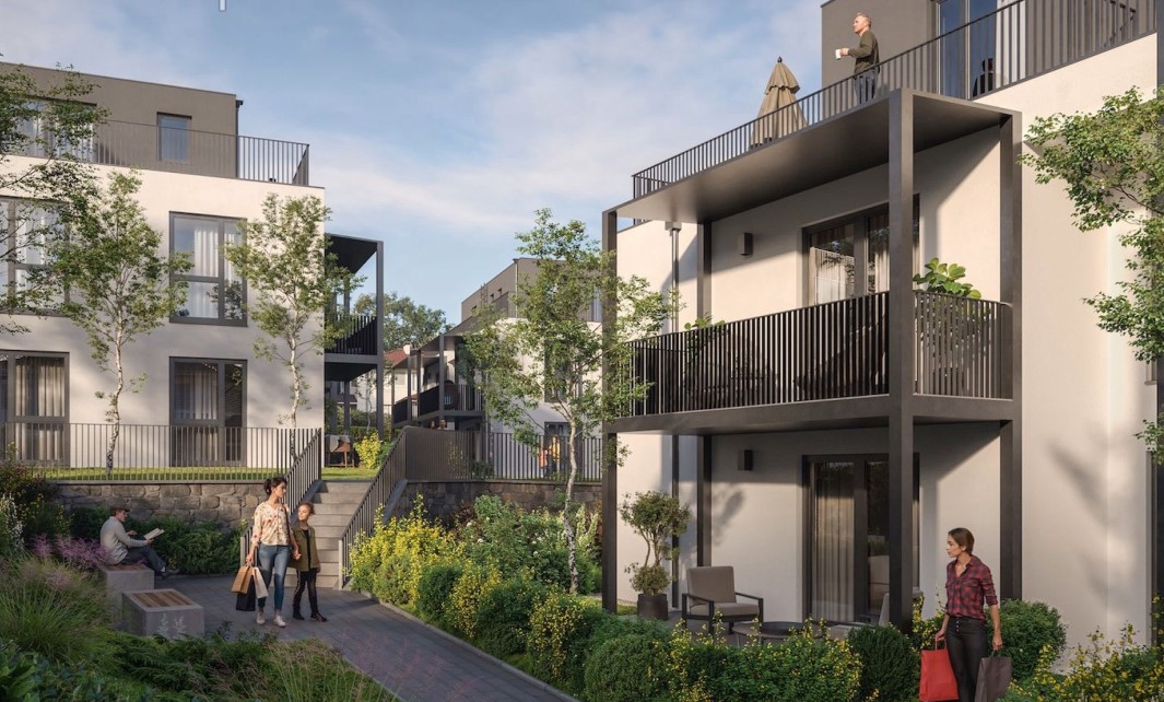 Moderne Wohnanlage mit Balkonen, Gärten und einem entspannten Ambiente.